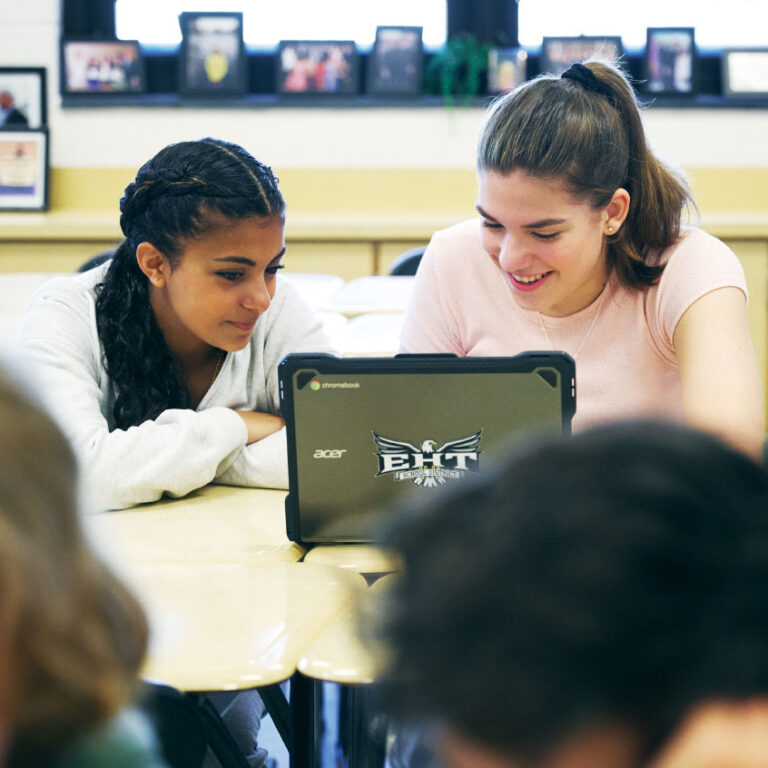 Students interacting with computer